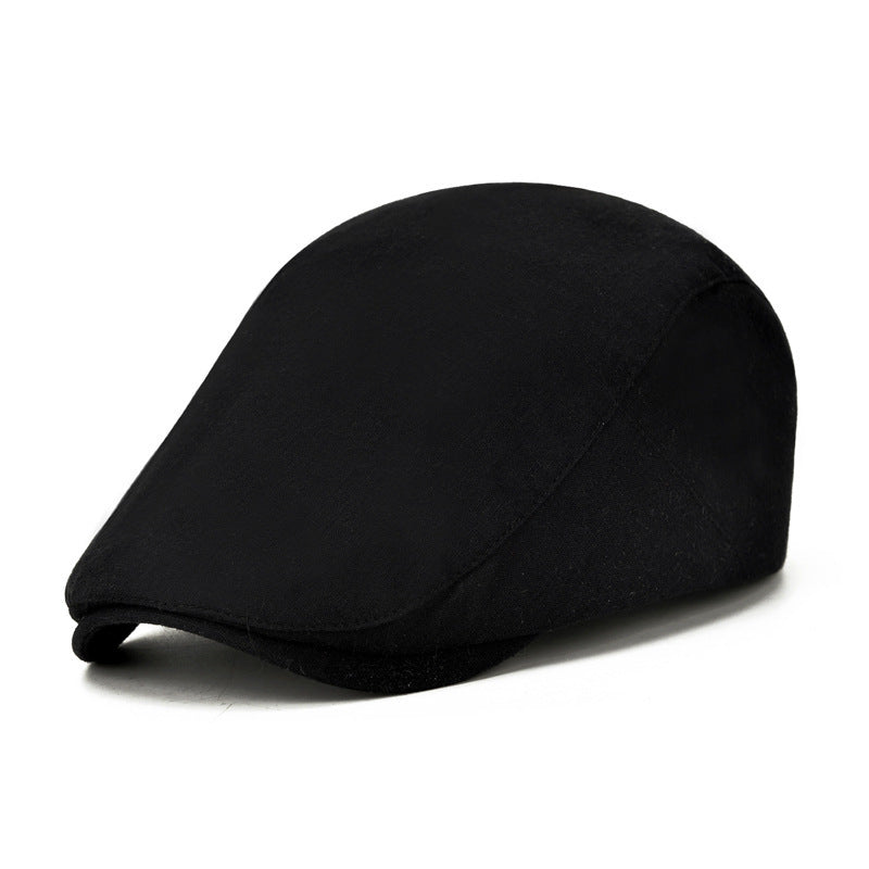 Black flat cap on a white background