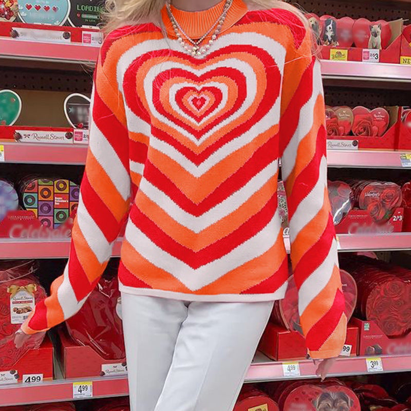 Person wearing a colorful heart-patterned sweater in a store aisle.