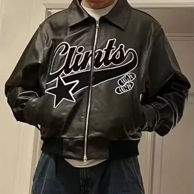 Black leather jacket with 'Clints' branding worn by a person indoors.